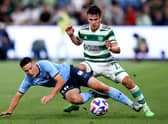 Joseph Lolley of Sydney competes with Alexandro Bernabei of Celtic