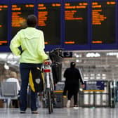 Passengers make their way through Glasgow Central station.