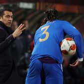 Giovanni van Bronckhorst, Manager of Rangers interacts with Calvin Bassey of Rangers