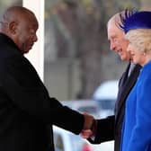 South Africa's President Cyril Ramaphosa is greeted by Britain's King Charles III and Britain's Camilla, Queen Consort 