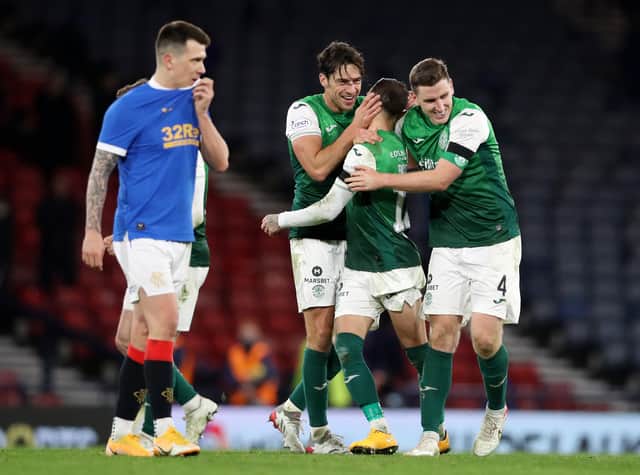 Joe Newell, Martin Boyle and Paul Hanlon of Hibernian celebrate their side's victory 