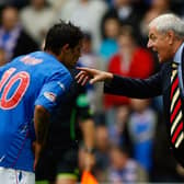 Walter Smith talks with Nacho Novo of Rangers during the Scottish Premier League match between Rangers and Celtic at Ibrox Stadium on October 20, 2007 in Glasgow