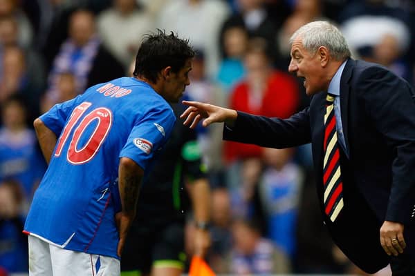 Walter Smith talks with Nacho Novo of Rangers during the Scottish Premier League match between Rangers and Celtic at Ibrox Stadium on October 20, 2007 in Glasgow