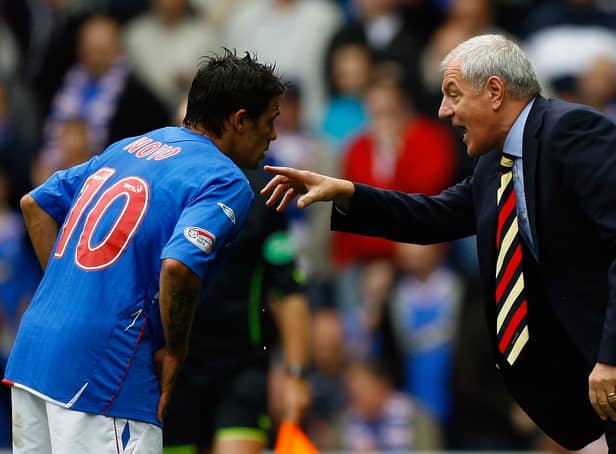 <p>Walter Smith talks with Nacho Novo of Rangers during the Scottish Premier League match between Rangers and Celtic at Ibrox Stadium on October 20, 2007 in Glasgow</p>