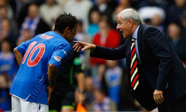Walter Smith talks with Nacho Novo of Rangers during the Scottish Premier League match between Rangers and Celtic at Ibrox Stadium on October 20, 2007 in Glasgow