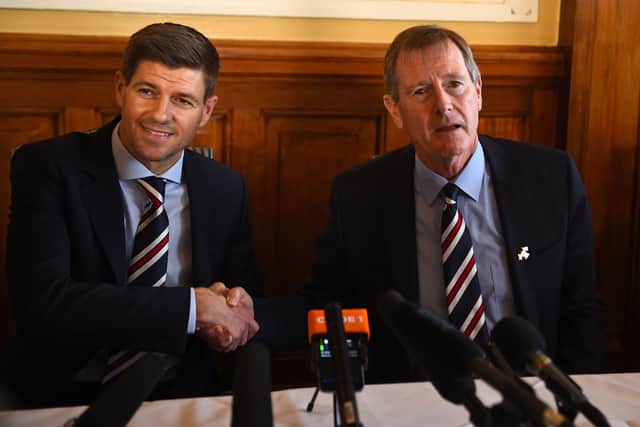 Former England and Liverpool captain Steven Gerrard (L) shakes hands with ex-Rangers chairman Dave King (R) as he is unveiled as the club’s new manager