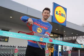 Sean Batty cutting the ribbon at the new Lidl in Airdrie.