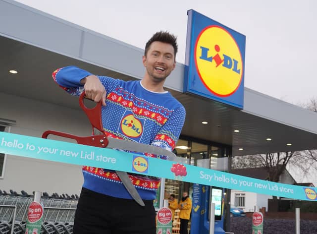 Sean Batty cutting the ribbon at the new Lidl in Airdrie.