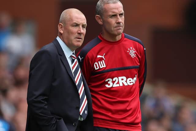 Mark Warburton during his time as Rangers manager speaking to assistant David Weir at Ibrox