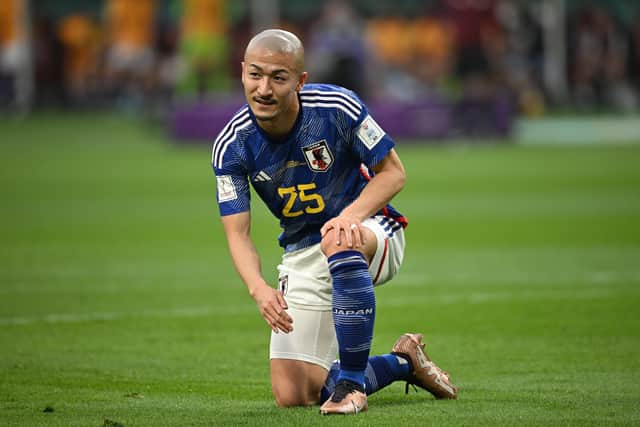 Daizen Maeda of Japan reacts after missing a chance