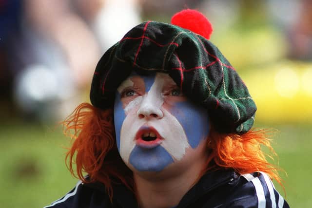 A young Scotland fan watches on against Norway.
