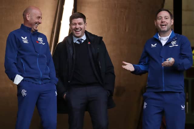 Rangers manager Steven Gerrard, his assistant Gary McAllister and Michael Beale share a joke