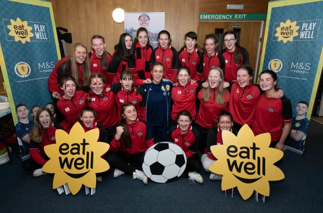 Scotland and Hibs centre-back Leah Eddie pictured with the Giffnock Soccer Centre under-16 girls team