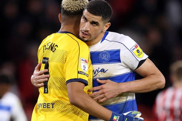 Leon Balogun of Queens Park Rangers celebrates with teammate Seny Dieng after a Championship victory 