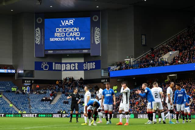 The LED board shows the VAR check which results in a red card for Morgan Boyes of Livingston (not pictured) during the Cinch Scottish Premiership match between Rangers and Livingston at Ibrox Stadium