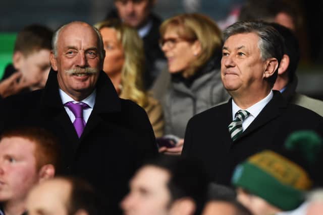 Dermot Desmond (L) and Chief Executive of Celtic Peter Lawwell look on at Celtic Park