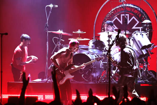 US rock band Red Hot Chili Peppers vocalist Anthony Kiedis, bassist Flea, and guitarist John Frusciante perform onstage at the 2022 MTV VMAs at Prudential Centre on August 28, 2022 in Newark, New Jersey. (Photo by Theo Wargo/Getty Images for MTV/Paramount Global)