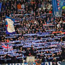Rangers' fans cheer during the UEFA Champions League Group A football match between Scotland's Rangers and Italy's Napoli at Ibrox stadium