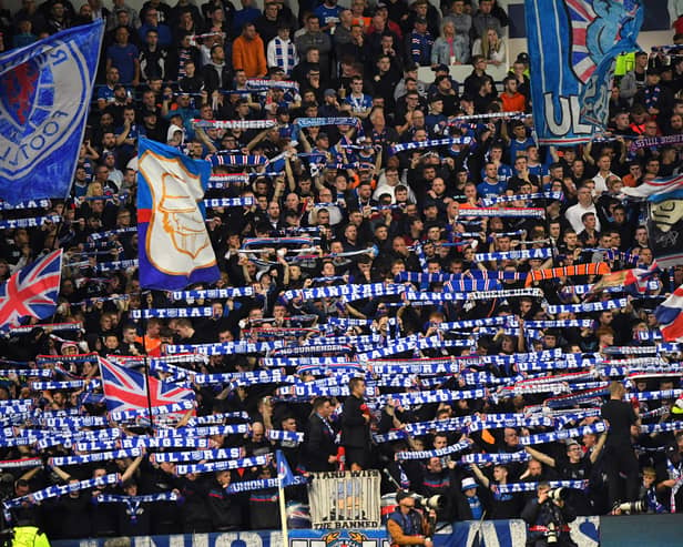 Rangers' fans cheer during the UEFA Champions League Group A football match between Scotland's Rangers and Italy's Napoli at Ibrox stadium