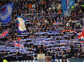 Rangers' fans cheer during the UEFA Champions League Group A football match between Scotland's Rangers and Italy's Napoli at Ibrox stadium