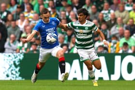 Jota of Celtic battles for possession with James Sands of Rangers