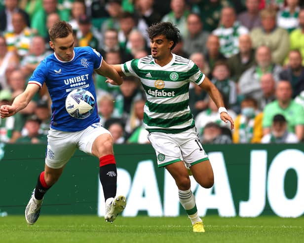 Jota of Celtic battles for possession with James Sands of Rangers