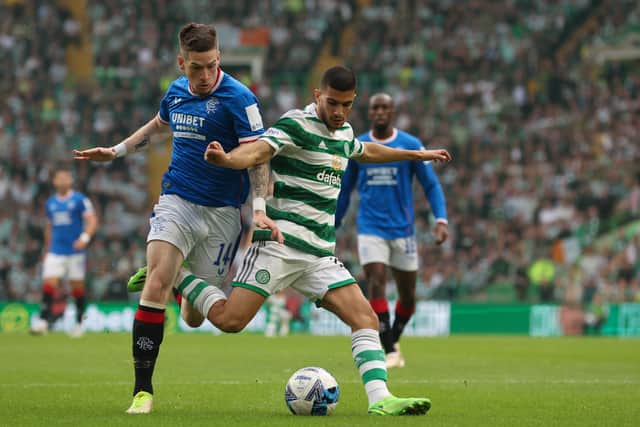 Ryan Kent of Rangers battles for possession with Liel Abada of Celtic 