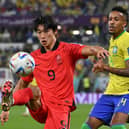 South Korea’s forward Cho Gue-sung controls the ball as Brazil’s defender Eder Militao looks on during a World Cup last-16 tie