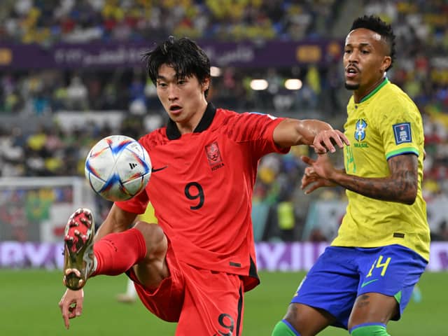 South Korea’s forward Cho Gue-sung controls the ball as Brazil’s defender Eder Militao looks on during a World Cup last-16 tie