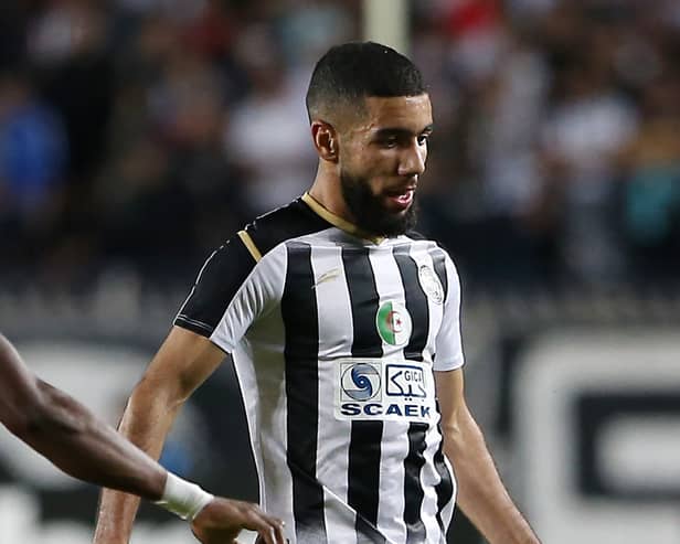 Ahly's midfielder Aliou Dieng (L) vies for the ball against Setif's forward Ahmed Kendouci (R) during the CAF Champions League Semi-Final between Algeria's ES Setif and Egypt's al-Ahly at the 5 July stadium in the Algiers suburb of Ben Aknoun 