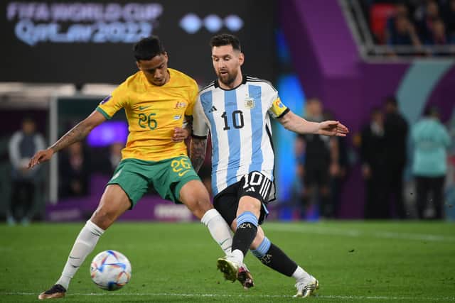 Australia’s midfielder Keanu Baccus (L) fights for the ball with Argentina’s forward Lionel Messi