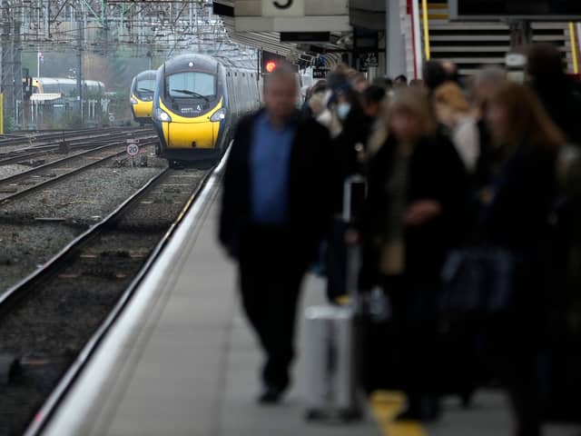 Passengers wait to board an Avanti West Coast mainline train at Crewe Station on December 01, 2022 in Crewe, England. The Rail, Maritime and Transport workers union (RMT) said its members will strike on eight days - December 13, 14, 16 and 17, and January 3, 4, 6 and 7 - the latest episode in a dispute over pay and working practices. (Photo by Christopher Furlong/Getty Images)