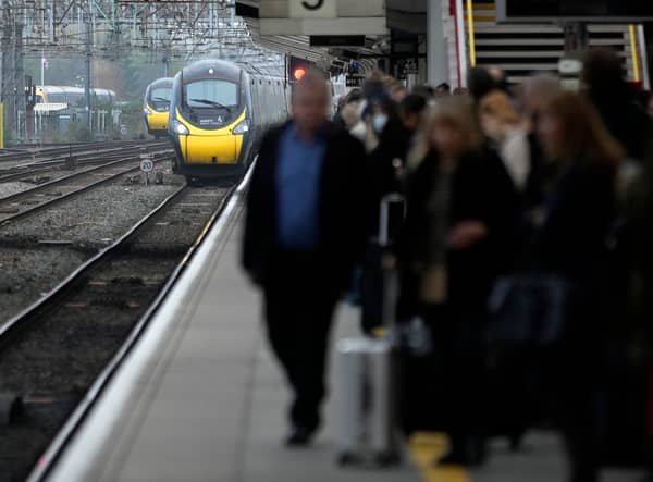 Passengers wait to board an Avanti West Coast mainline train at Crewe Station on December 01, 2022 in Crewe, England. The Rail, Maritime and Transport workers union (RMT) said its members will strike on eight days - December 13, 14, 16 and 17, and January 3, 4, 6 and 7 - the latest episode in a dispute over pay and working practices. (Photo by Christopher Furlong/Getty Images)