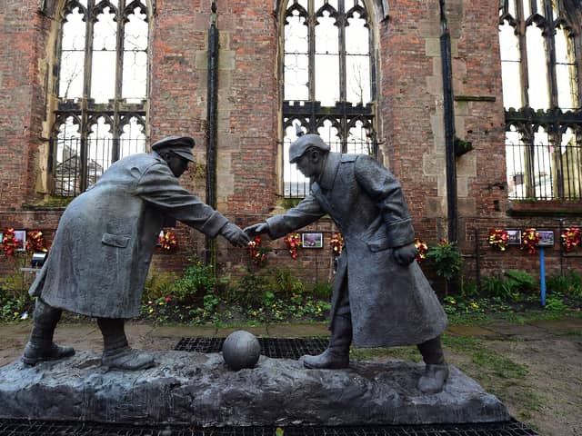 A resin model of a sculpture illustrating the WW1 Christmas Truce football match is pictured during a photocall inside the remains of St Luke's Church in Liverpool