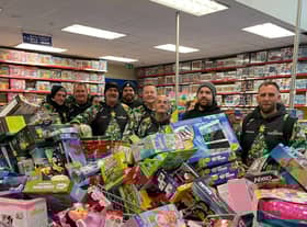 Reese, far right, and his team with some of hundreds of toys they bough from Smyth's Toy Shop