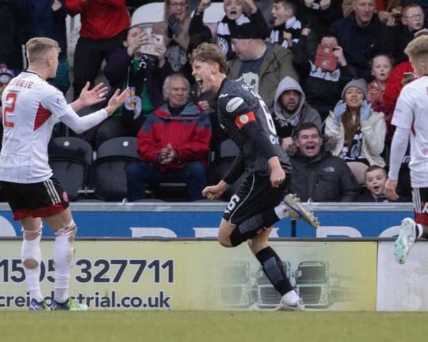 St Mirren captain Mark O’Hara wheels away in celebration after making it 2-1 against Aberdeen (Image: SNS Group)
