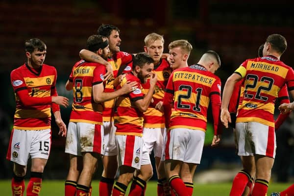 Partick Thistle players celebrate their winning goal (Image: SNS Group)
