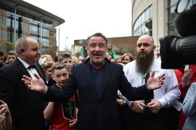 Michael Flatley, star of Riverdance and Lord of the Dance is mobbed by fans as he makes an appearance during the opening day of the World Irish Dancing Championships at the Waterfront Hall on April 10, 2022 in Belfast
