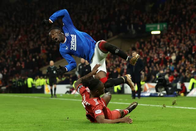 Anthony Stewart of Aberdeen fouls Fashion Sakala of Rangers which leads to a red card