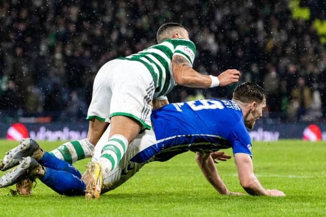 Celtic striker Giorgos Giakoumakis challenges Kilmarnock defender Joe Wright inside the box (Image: SNS Group)