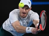 Britain’s Andy Murray hits a return against Australia’s Thanasi Kokkinakis during their men’s singles match on day four of the Australian Open tennis tournament in Melbourne on January 20, 2023. Photo by WILLIAM WEST/AFP via Getty Images)