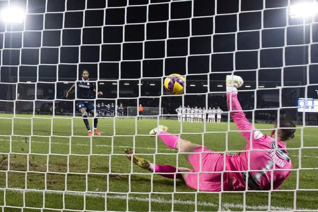 St Mirren goalkeeper Trevor Carson saves a penalty from Dundee’s Kwame Thomas during the shoot-out. (Image: SNS Group)