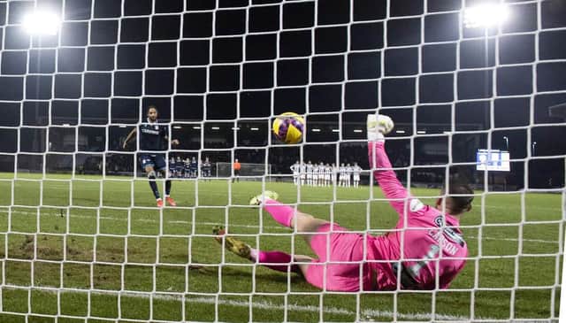 St Mirren goalkeeper Trevor Carson saves a penalty from Dundee’s Kwame Thomas during the shoot-out. (Image: SNS Group)