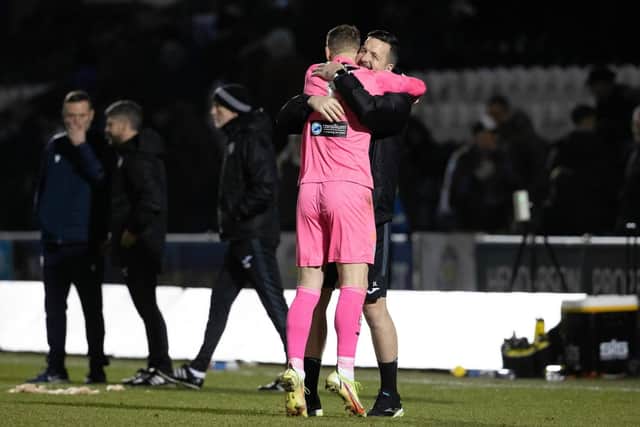 St Mirren’s Trevor Carson is congratulated by goalkeeping coach Jamie Langfield after his penalty shoot-out heroics (Image: SNS Group)