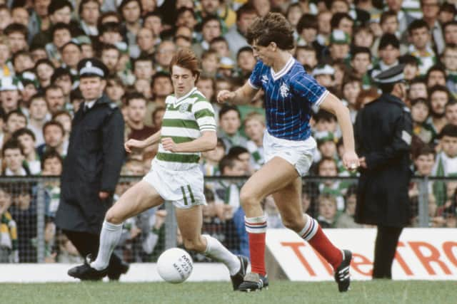 Jim Melrose of Celtic goes past Rangers player Dave McPherson 