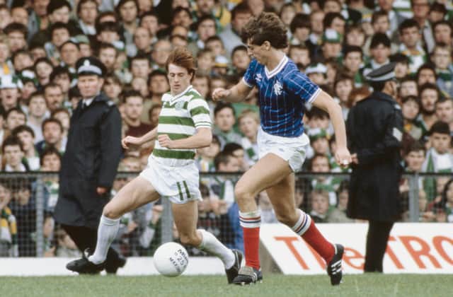 Jim Melrose of Celtic goes past Rangers player Dave McPherson 