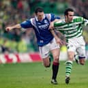 Rangers player Ian Ferguson (l) challenges Paolo Di Canio of Celtic during an Old Firm game at Parkhead on March 16, 1997 in Glasgow
