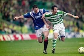 Rangers player Ian Ferguson (l) challenges Paolo Di Canio of Celtic during an Old Firm game at Parkhead on March 16, 1997 in Glasgow