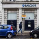 A man walks past a Barclays bank, in the Channel island's port capital Saint Helier, on December 11, 2022. (Photo by Sebastien SALOM-GOMIS / AFP) (Photo by SEBASTIEN SALOM-GOMIS/AFP via Getty Images)