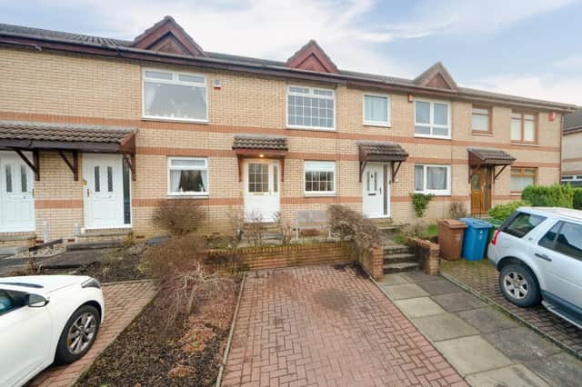 For Sale: Well-presented and stylish mid-terrace house with private parking and a garden listed for £100,000
